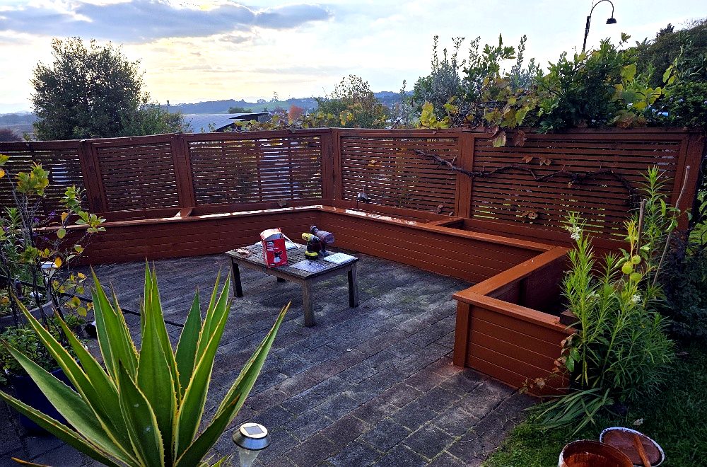 Finished stained timber courtyard screen and bench seating